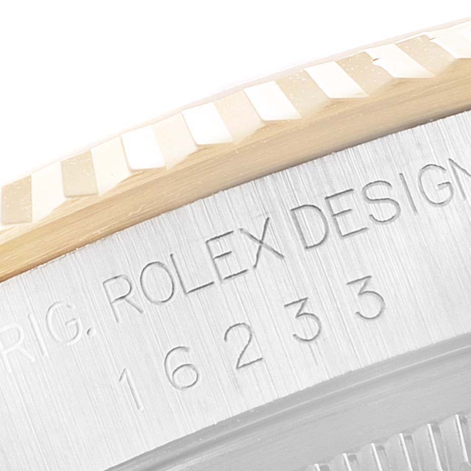 The image shows a close-up of the engraved bezel and case back of a Rolex Datejust 16233 Men's Steel and Gold (two tone) White Dial 16233 Men's Steel and Gold (two tone) White Dial, highlighting the model number 16233.