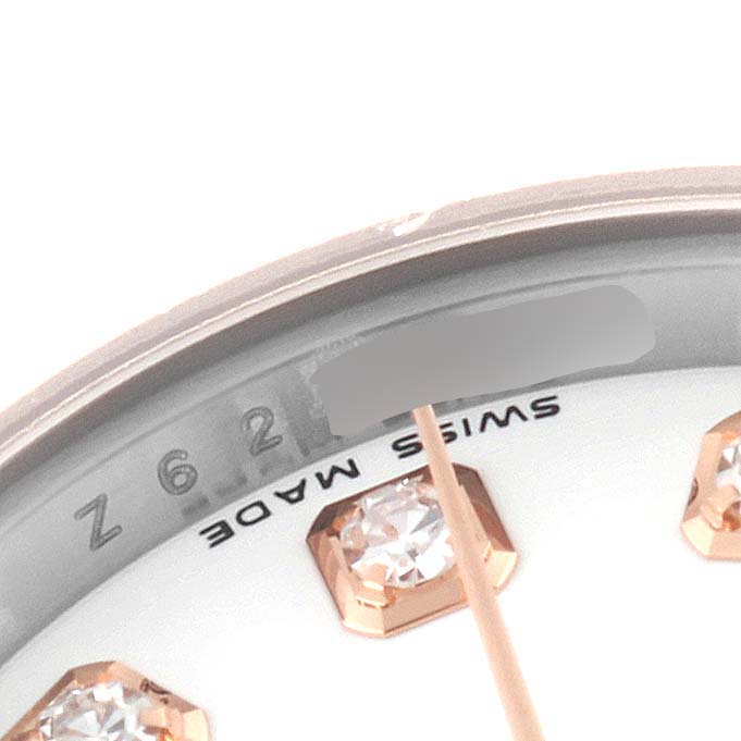 The image shows a close-up of the dial and diamond hour markers of a Rolex Datejust 179161 Women's Steel and Gold (two tone) White Dial 179161 Women's Steel and Gold (two tone) White Dial watch, with a partial view of the "Swiss Made" label.