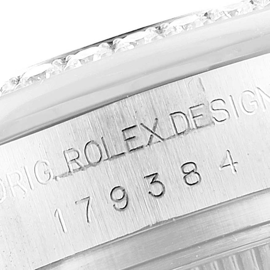 This image shows a close-up of the side of the Rolex Datejust 179384 Women
s Stainless Steel Mother of Pearl Dial 179384 Women
s Stainless Steel Mother of Pearl Dial watch casing, highlighting the engraved serial number and "Rolex Design" text.
