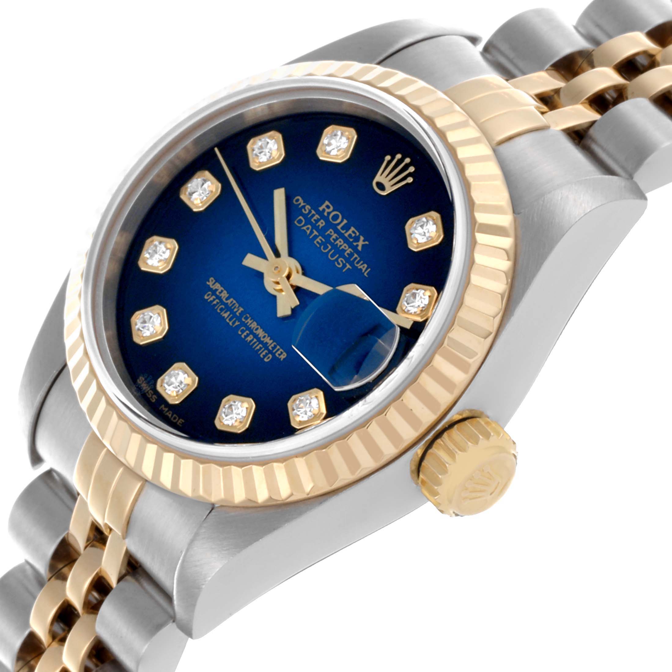The Rolex Datejust 79173 Women's Steel and Gold (two tone) Blue Dial 79173 Women's Steel and Gold (two tone) Blue Dial watch is shown at an angle highlighting the dial, crown, and bracelet with a blue face and diamond markers.