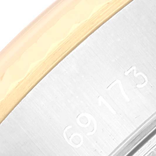 This close-up image shows the case sides and model number "69173" engraving of a Rolex Datejust 69173 Women's Steel and Gold (two tone) Champagne Dial 69173 Women's Steel and Gold (two tone) Champagne Dial watch.