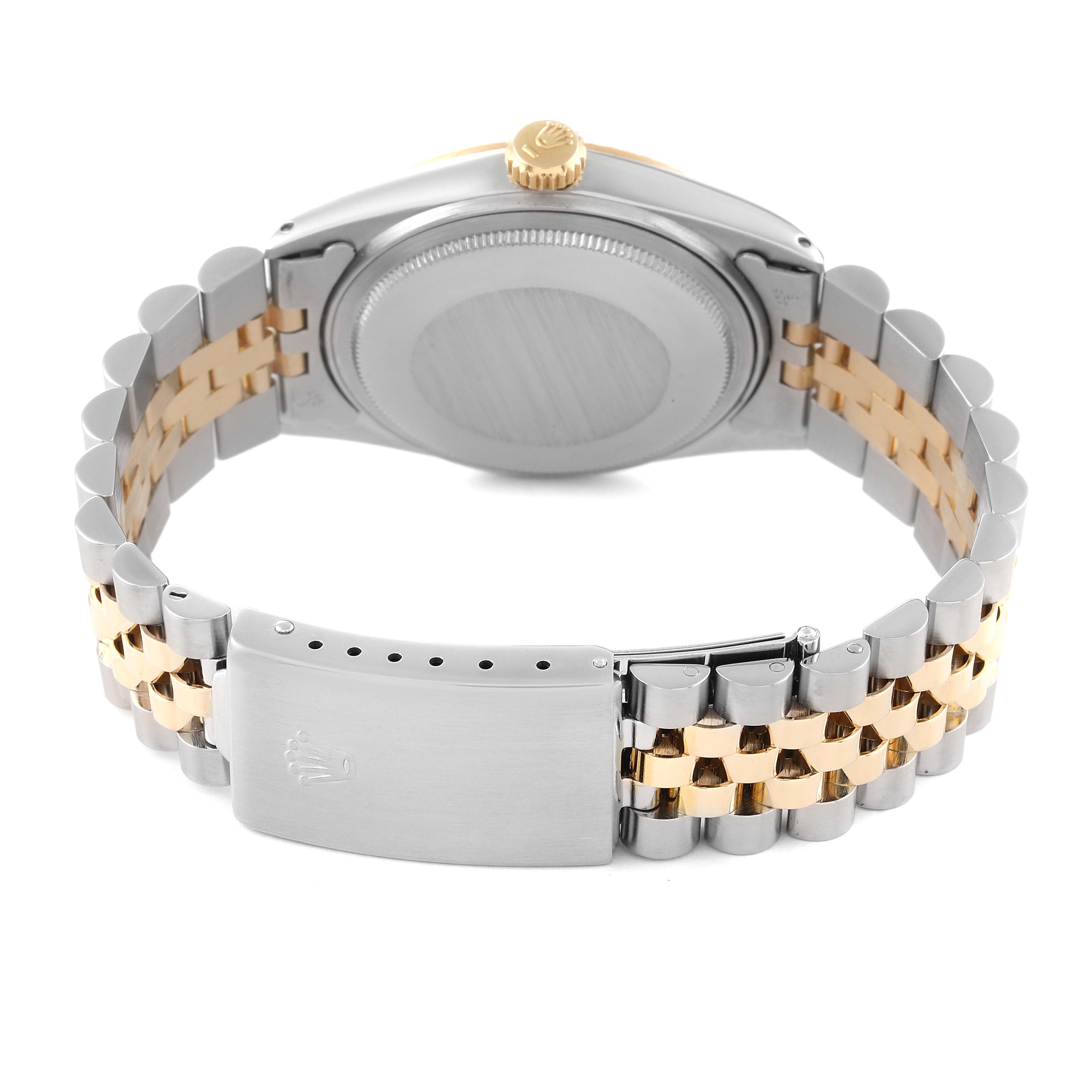 The image shows the back of the Rolex Datejust 16013 Men's Steel and Gold (two tone) Champagne Dial 16013 Men's Steel and Gold (two tone) Champagne Dial watch, including its bracelet and clasp.