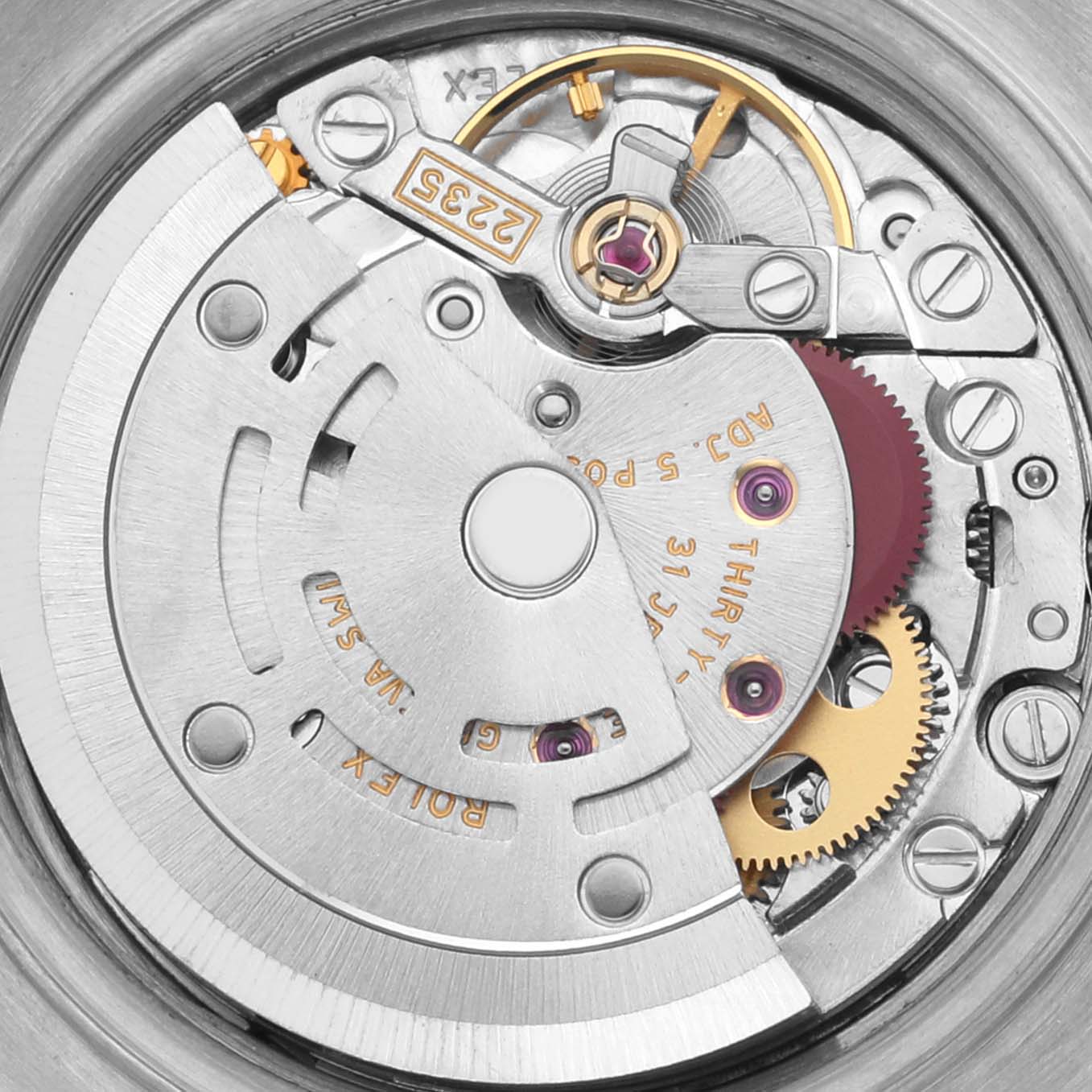 This image shows the movement mechanism of a Rolex Datejust 79173 Women's Steel and Gold (two tone) White Dial 79173 Women's Steel and Gold (two tone) White Dial watch, highlighting gears and rotor from a close-up angle.