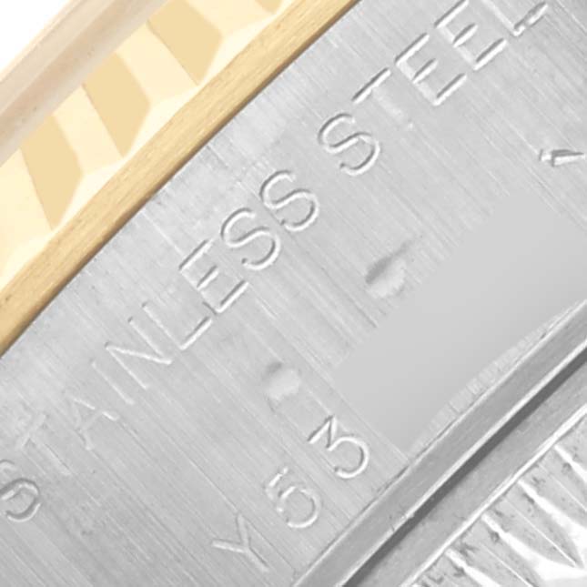 The image shows a close-up of the side engraving on a Rolex Datejust 79173 Women's Steel and Gold (two tone) White Dial 79173 Women's Steel and Gold (two tone) White Dial, highlighting the stainless steel detail.