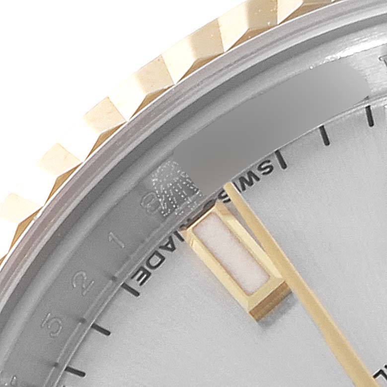 This image shows a close-up of the dial, bezel, and hour markers of a Rolex Datejust 179173 Women
s Steel and Gold (two tone) Silver Dial 179173 Women
s Steel and Gold (two tone) Silver Dial model.
