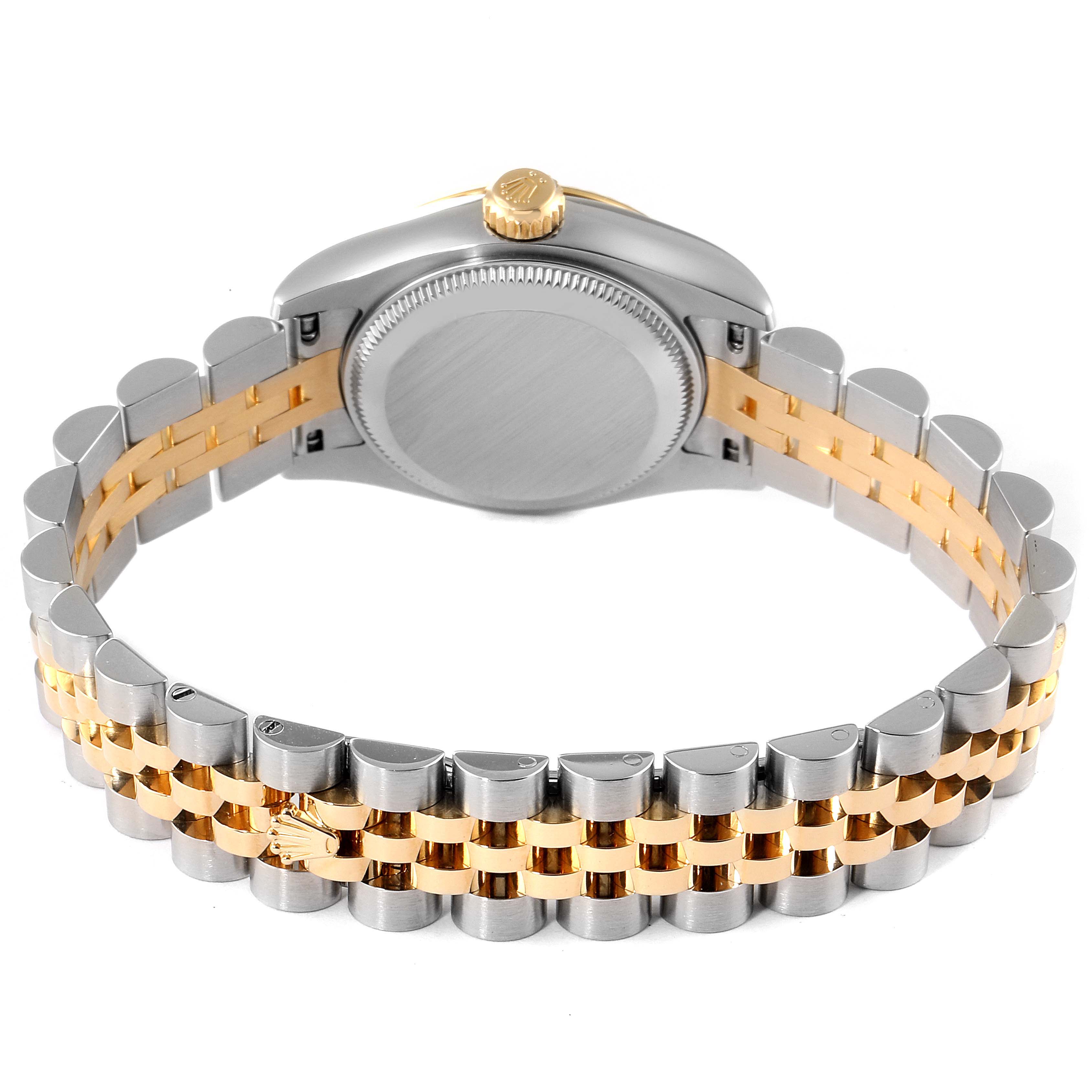 The image displays the back case and two-tone bracelet of a Rolex Datejust 179173 Women
s Steel and Gold (two tone) Silver Dial 179173 Women
s Steel and Gold (two tone) Silver Dial watch, viewed from an angle towards the backside.