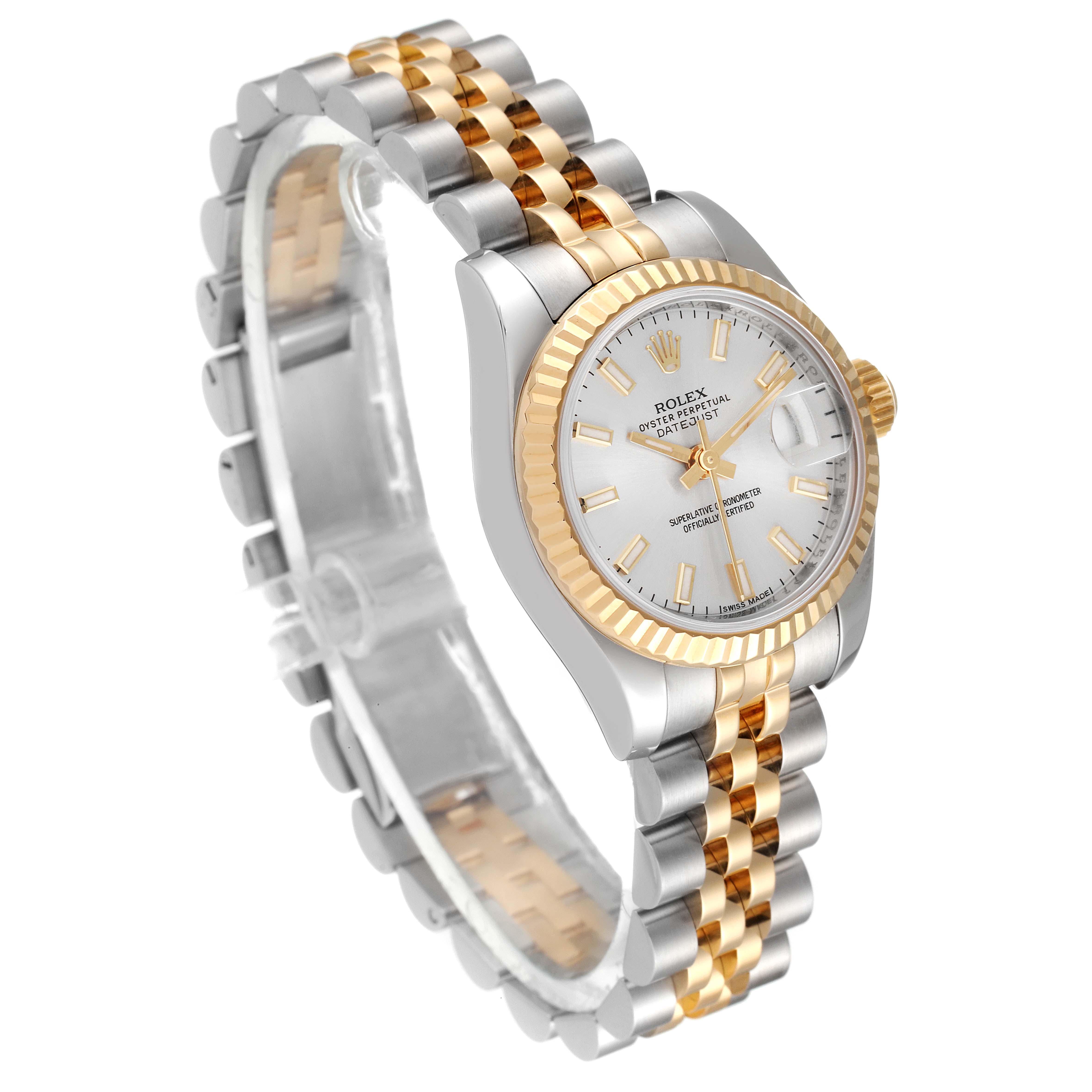 The Rolex Datejust 179173 Women
s Steel and Gold (two tone) Silver Dial 179173 Women
s Steel and Gold (two tone) Silver Dial is shown at an angle displaying its silver and gold Jubilee bracelet and white dial with a date window.