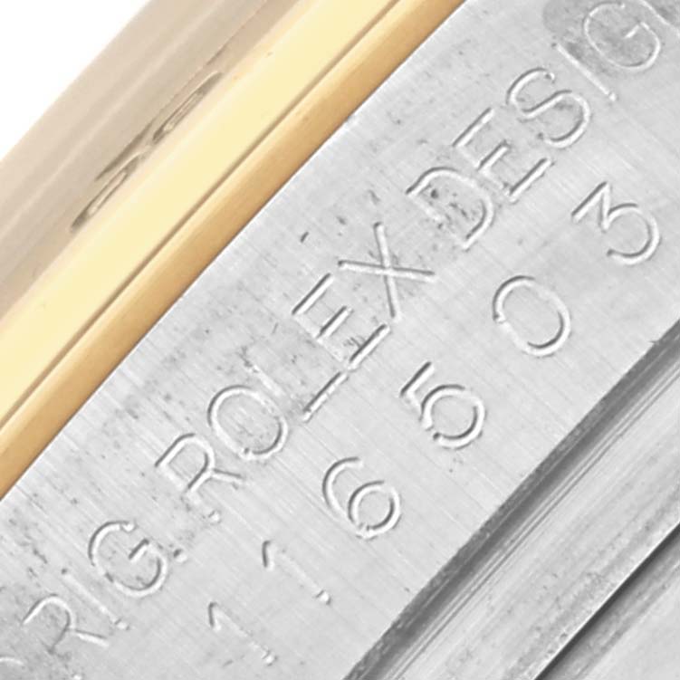 The image shows a close-up of the Rolex Daytona 116503 Men's Steel and Gold (two tone) Mother of Pearl Dial 116503 Men's Steel and Gold (two tone) Mother of Pearl Dial model's side engraving on the watch case.