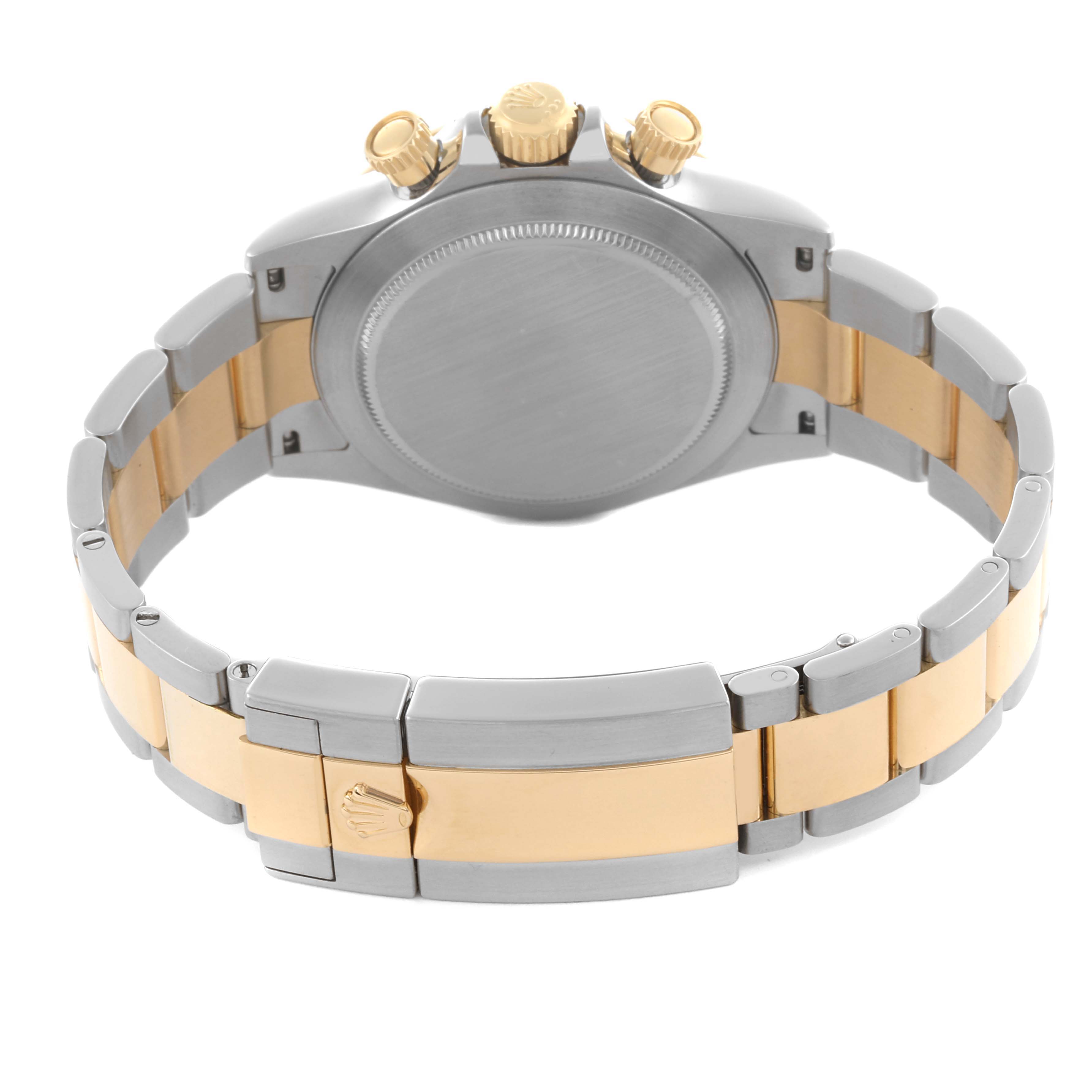 The Rolex Daytona 116503 Men's Steel and Gold (two tone) Mother of Pearl Dial 116503 Men's Steel and Gold (two tone) Mother of Pearl Dial watch is shown from the back, displaying the case back, bracelet, clasp, and crown.