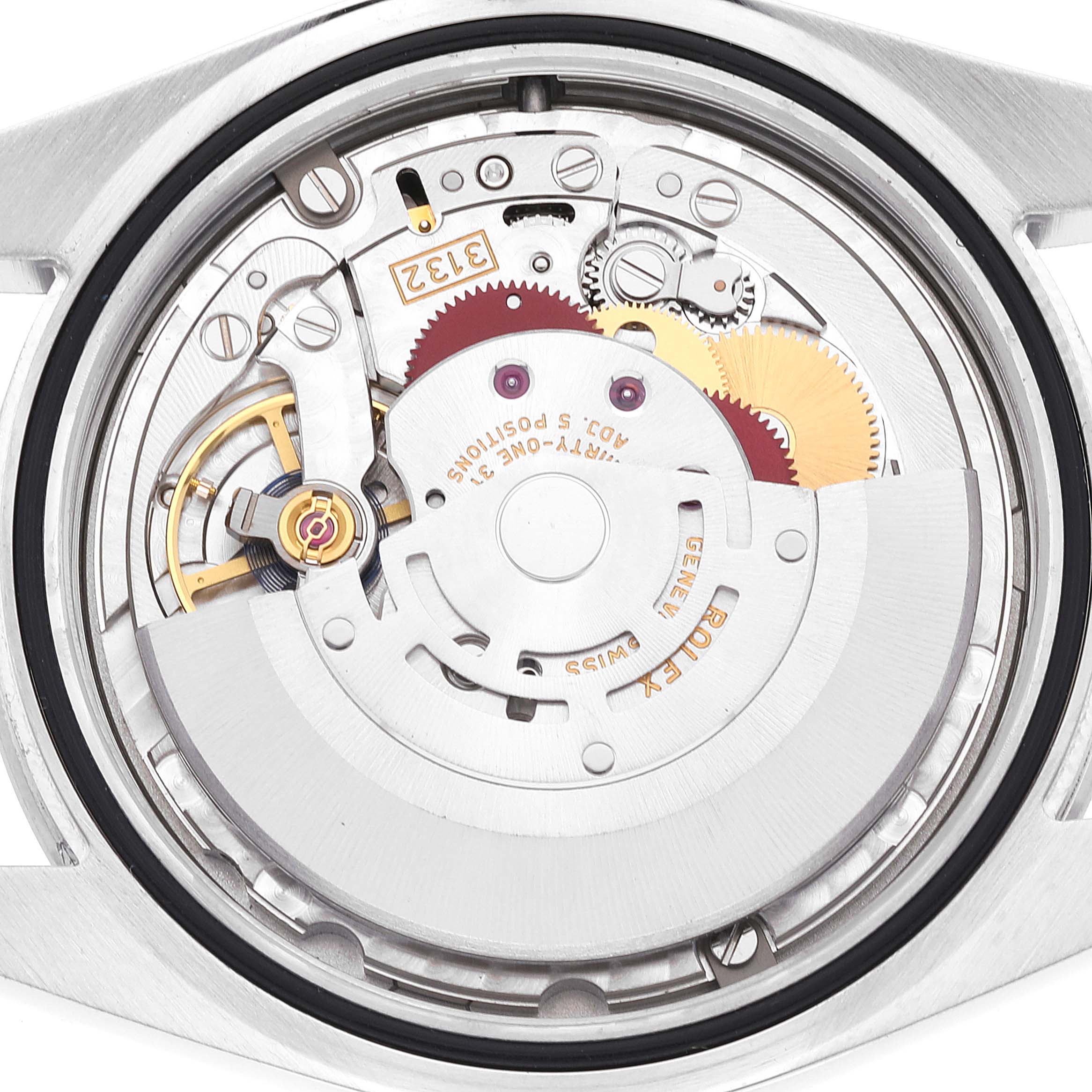 This image shows the internal mechanism of a Rolex Explorer 214270 Men's Stainless Steel Black Dial 214270 Men's Stainless Steel Black Dial watch from a rear angle, highlighting the intricate gears and components.