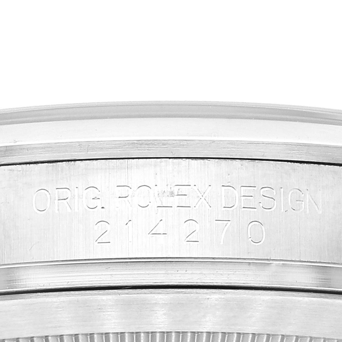 This image shows a close-up of the case side of a Rolex Explorer 214270 Men's Stainless Steel Black Dial 214270 Men's Stainless Steel Black Dial, displaying the engraved model number "214270" and "ORIG. ROLEX DESIGN".