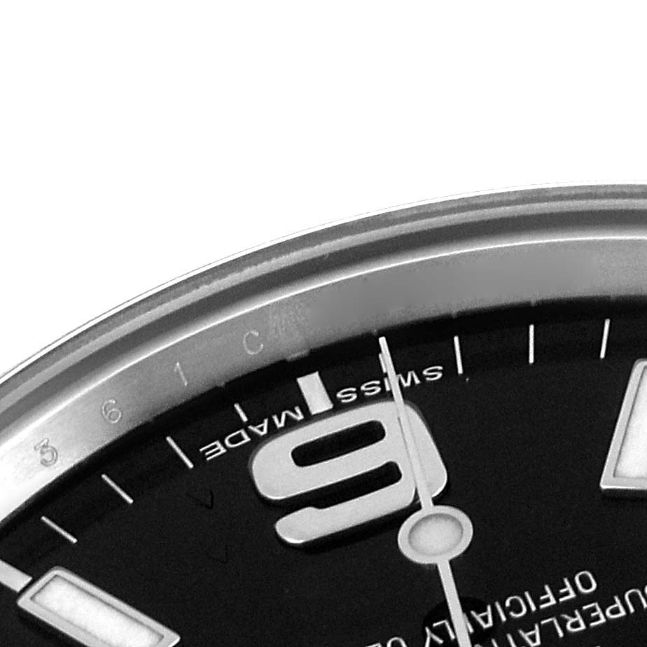 The image shows a close-up of the dial of a Rolex Explorer 214270 Men's Stainless Steel Black Dial 214270 Men's Stainless Steel Black Dial watch, focusing on the "6" numeral and surrounding markers.