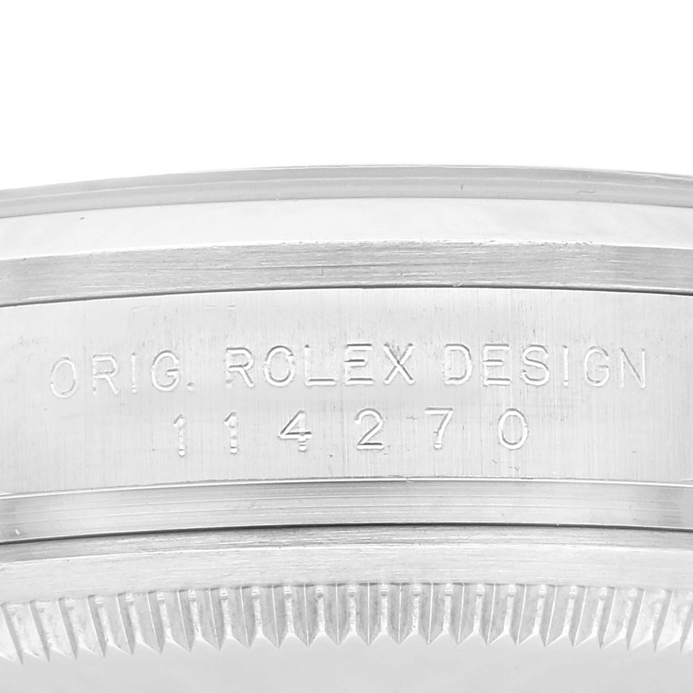 Close-up of the edge and case back of a Rolex Explorer 114270 Men's Stainless Steel Black Dial 114270 Men's Stainless Steel Black Dial model, showing engraving details.