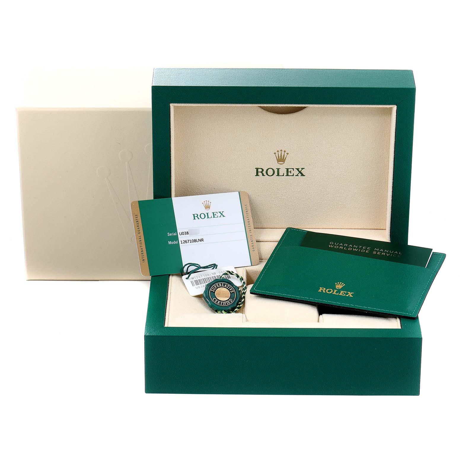 This image shows the packaging, warranty card, manuals, and an accessory for the Rolex GMT-Master 126710 Men
s Stainless Steel Black Dial 126710 Men
s Stainless Steel Black Dial watch.
