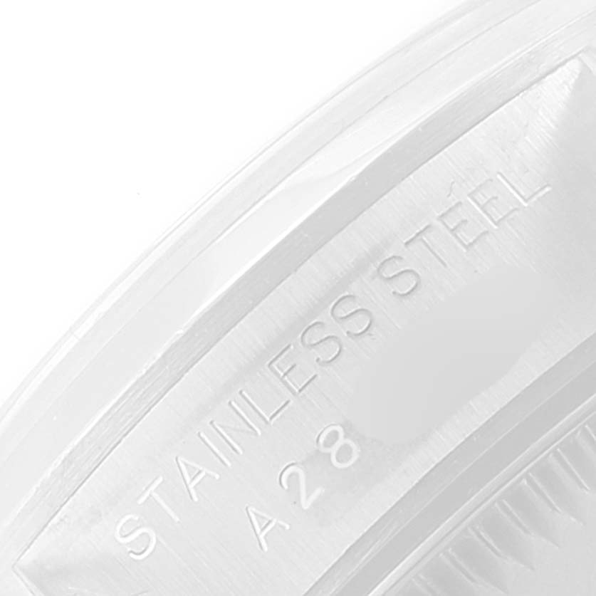 This image shows a close-up of the case back engraving of the Rolex Datejust 76080 Women's Stainless Steel Black Dial 76080 Women's Stainless Steel Black Dial watch, highlighting "STAINLESS STEEL".