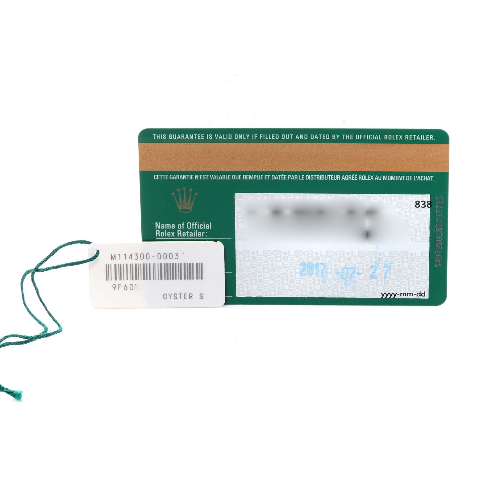 The image shows a warranty card alongside a tag for a Rolex Oyster Perpetual 114300 Men
s Stainless Steel Blue Dial 114300 Men
s Stainless Steel Blue Dial watch, model M114300-0003.