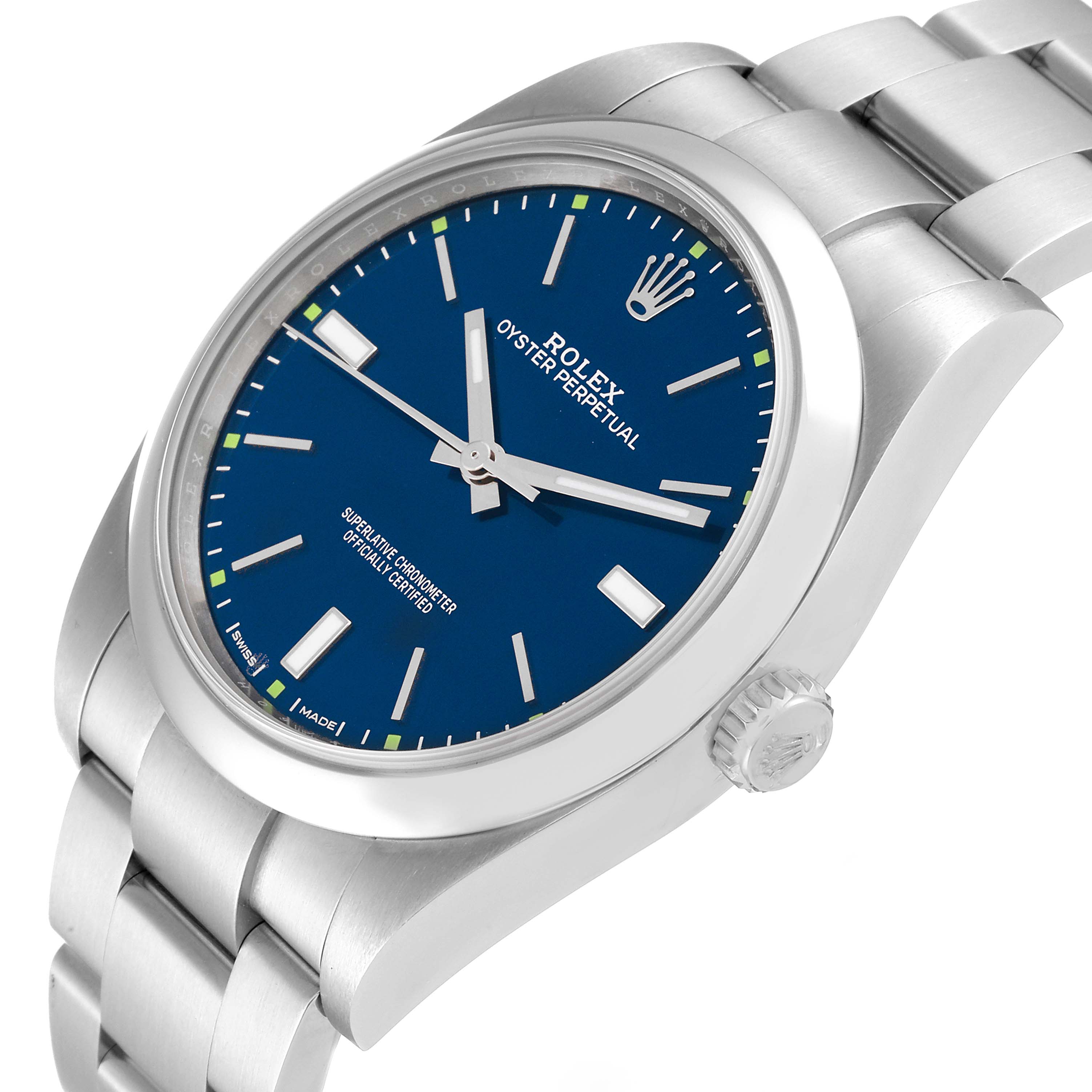 This image shows a Rolex Oyster Perpetual 114300 Men
s Stainless Steel Blue Dial 114300 Men
s Stainless Steel Blue Dial watch at an angled view of the face, crown, and part of the bracelet.