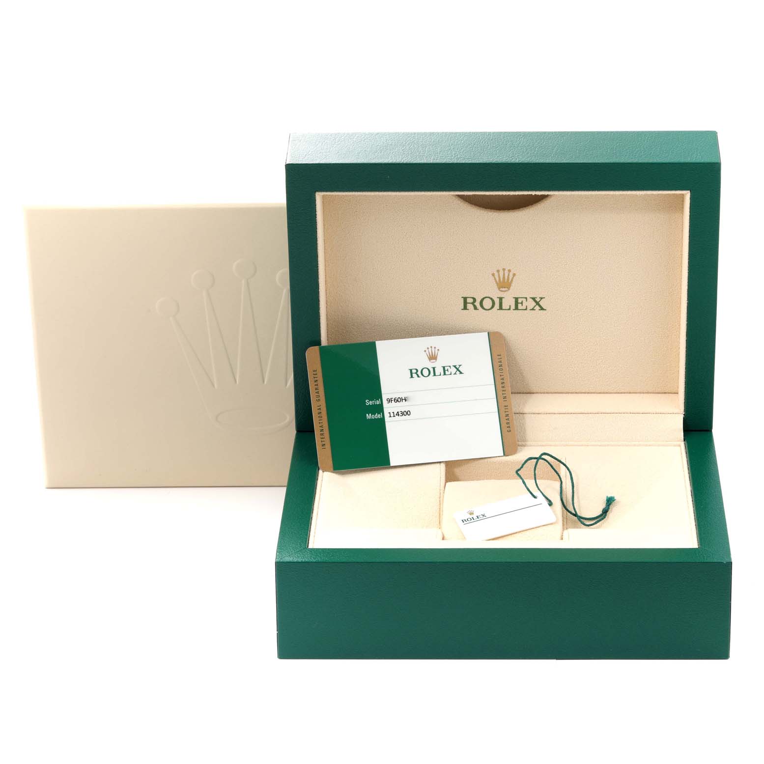 The image shows the packaging, warranty card, and tag of a Rolex Oyster Perpetual 114300 Men
s Stainless Steel Blue Dial 114300 Men
s Stainless Steel Blue Dial watch.