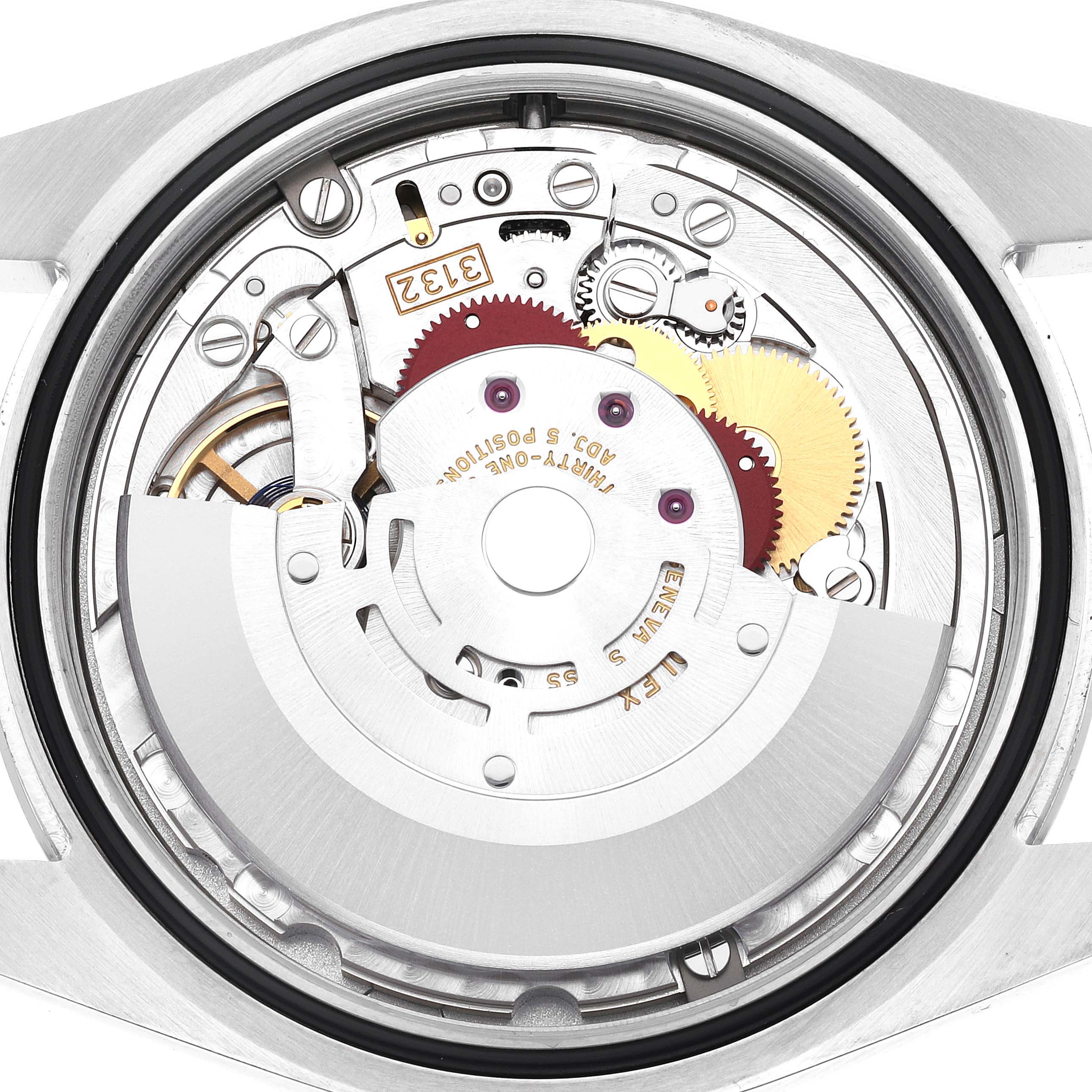 The image shows a close-up of the internal mechanism of a Rolex Oyster Perpetual 114300 Men
s Stainless Steel Blue Dial 114300 Men
s Stainless Steel Blue Dial watch, displaying the gears and movement components.