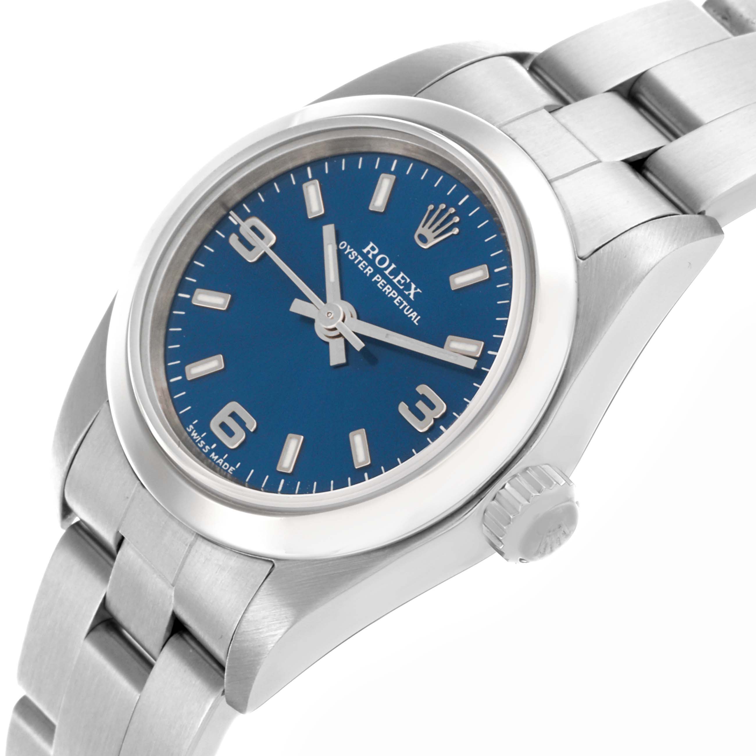 The Rolex Oyster Perpetual 76080 Women's Stainless Steel Blue Dial 76080 Women's Stainless Steel Blue Dial watch is shown at a slight angle, highlighting its blue dial, bezel, and bracelet.