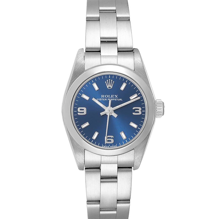 The Rolex Oyster Perpetual watch is shown from the front, displaying its blue dial, silver hands, and stainless steel bracelet.