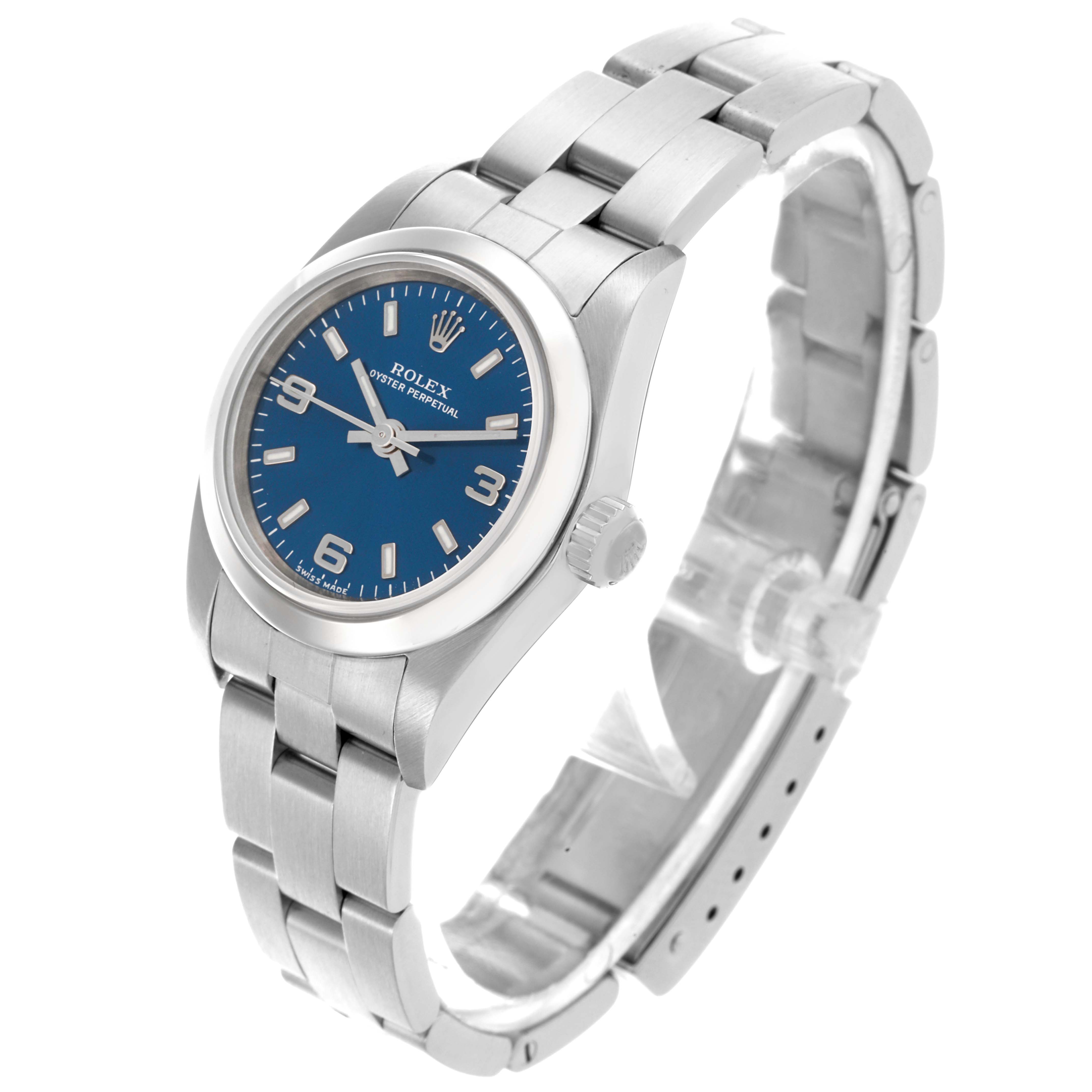 The Rolex Oyster Perpetual 76080 Women's Stainless Steel Blue Dial 76080 Women's Stainless Steel Blue Dial watch is shown at a three-quarter angle, highlighting the face, bezel, crown, and bracelet.
