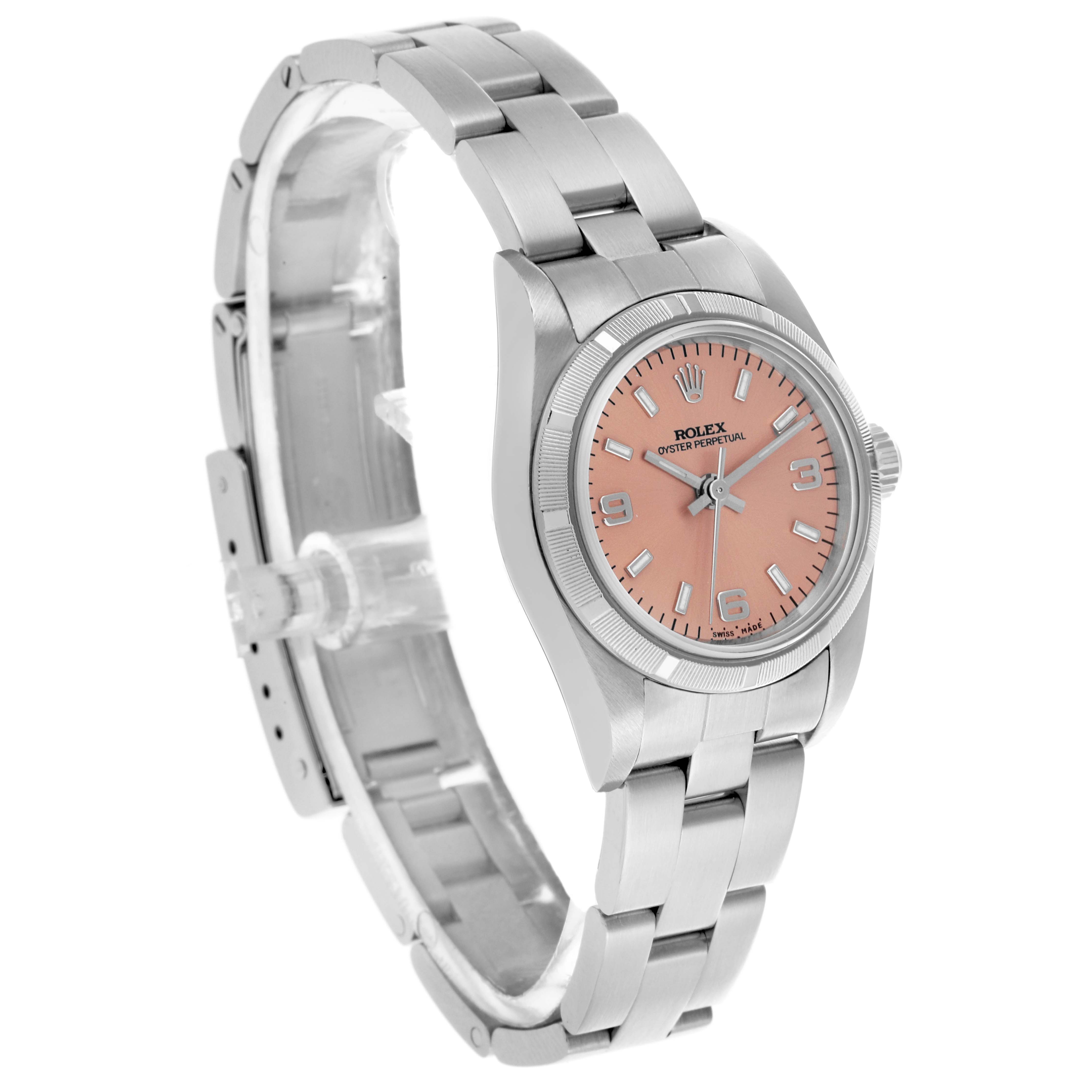The Rolex Oyster Perpetual 76030 Women's Stainless Steel Pink Dial 76030 Women's Stainless Steel Pink Dial watch is shown at a three-quarter angle, highlighting the face, bezel, and bracelet.