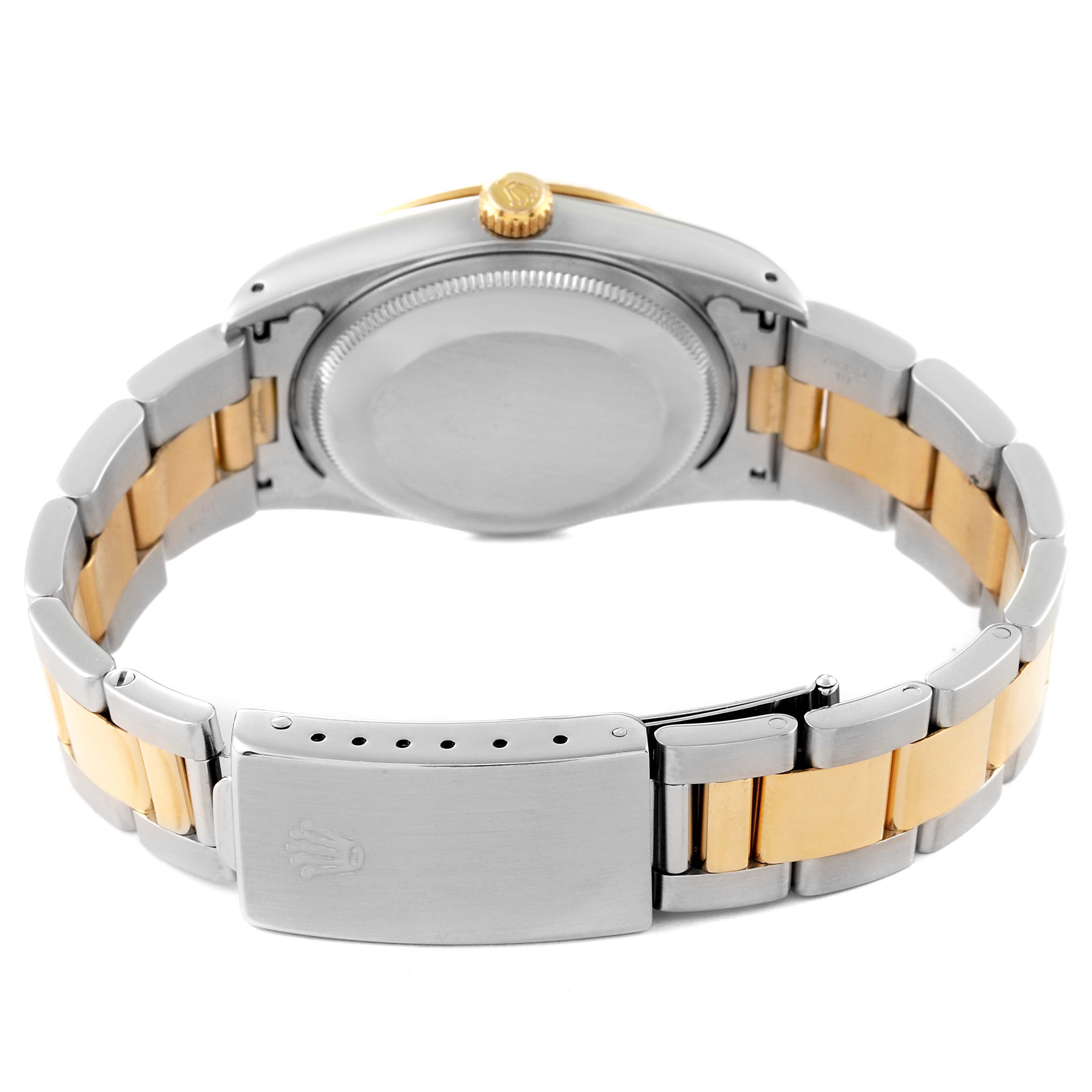 The image shows the back view of a Rolex Oyster Perpetual 14233 Men
s Steel and Gold (two tone) White Dial 14233 Men
s Steel and Gold (two tone) White Dial watch, highlighting the clasp, bracelet, and case back.