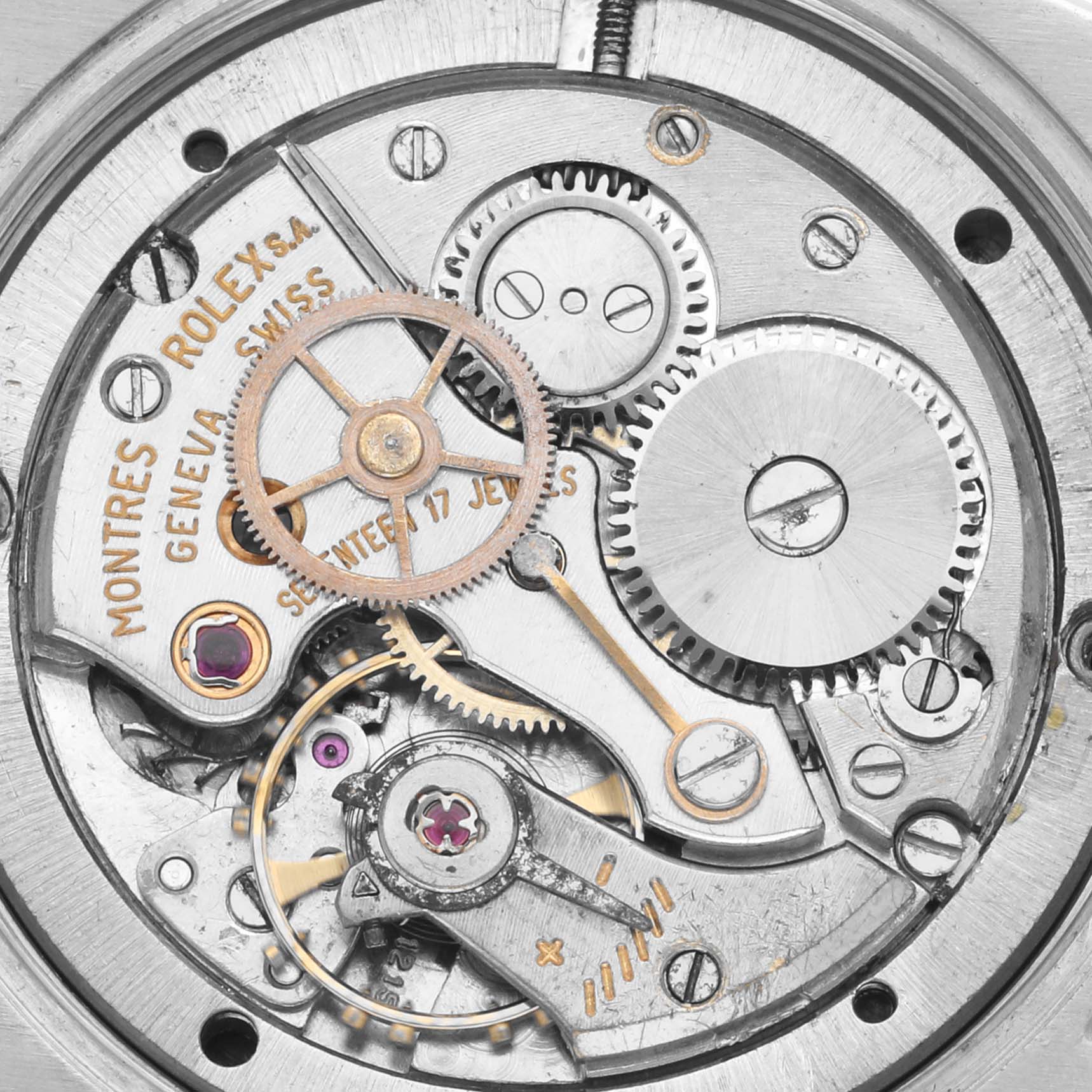 This image shows the movement mechanism of a Rolex Date 6694 Men's Stainless Steel Black Dial 6694 Men's Stainless Steel Black Dial watch, highlighting gears and jewels from a top-down angle.