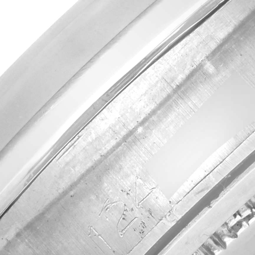 The image shows a close-up of the edge and inner markings of the bezel of a Rolex Date 6694 Men's Stainless Steel Black Dial 6694 Men's Stainless Steel Black Dial model watch.