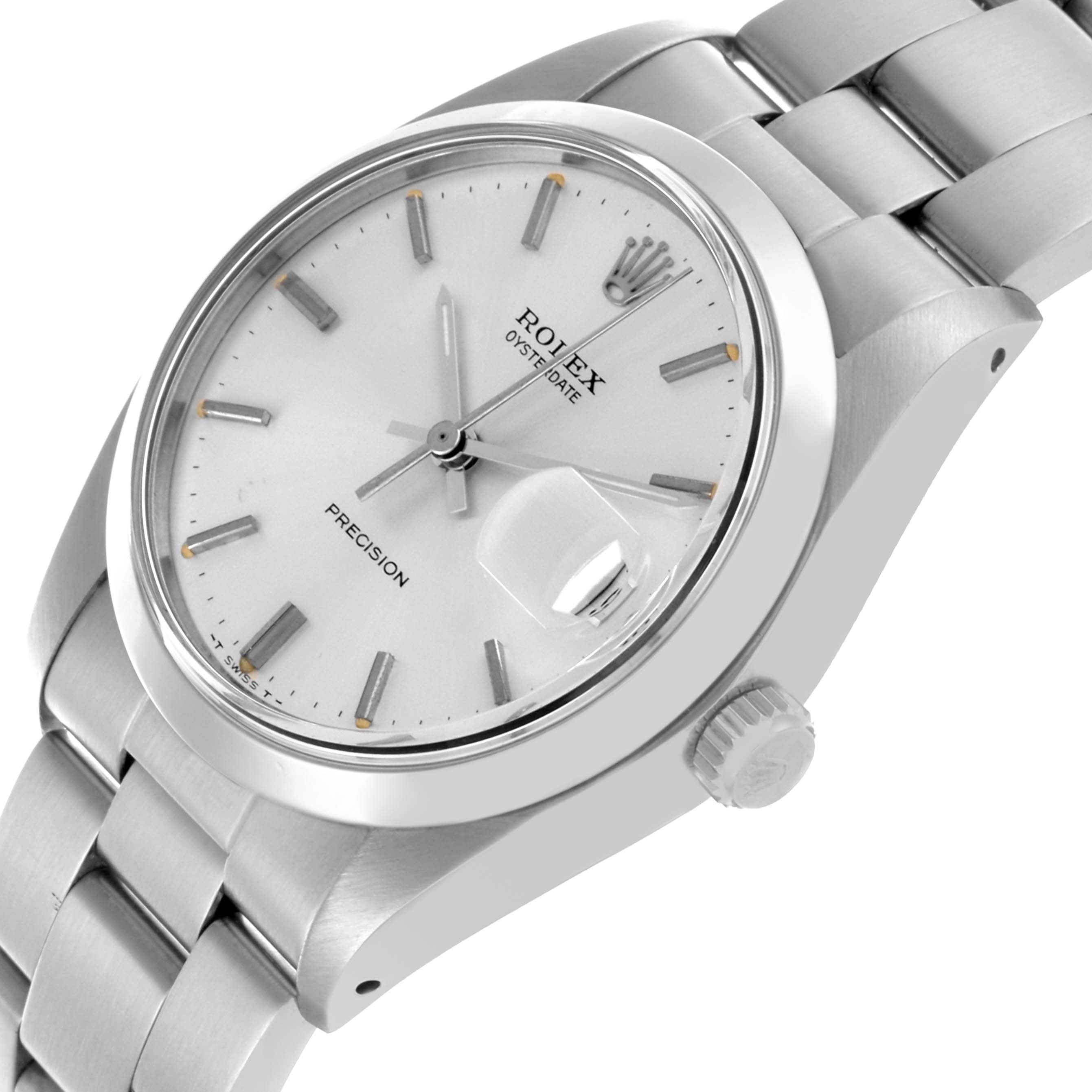 The Rolex Date 6694 Men's Stainless Steel Silver Dial 6694 Men's Stainless Steel Silver Dial model watch is shown at an angled side view, highlighting its face, bracelet, crown, and cyclops lens.