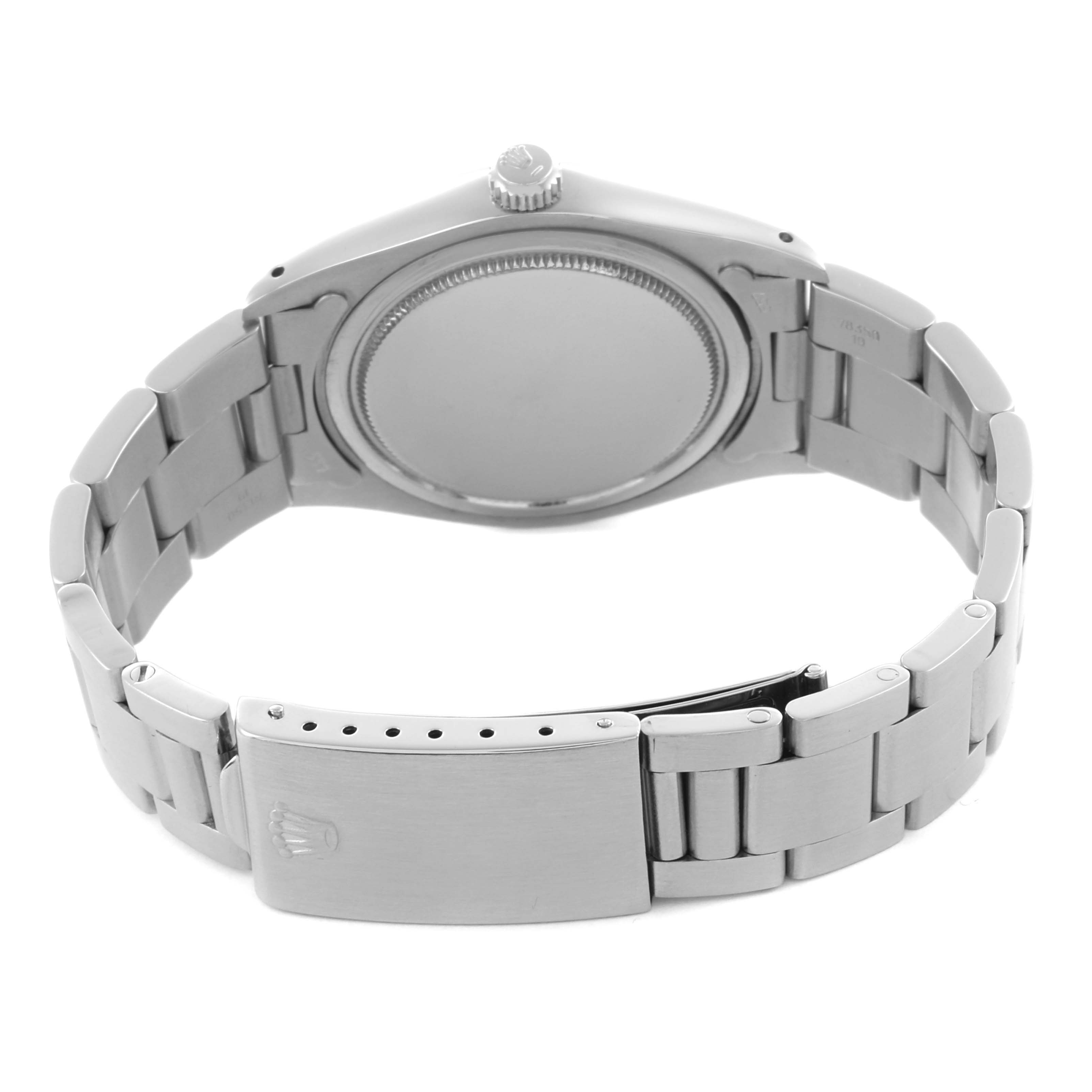 The Rolex Date 6694 Men's Stainless Steel Silver Dial 6694 Men's Stainless Steel Silver Dial model is shown from the back, highlighting the case back, bracelet, and clasp.