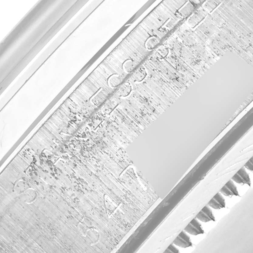 The image shows a close-up of the inner case edge of a Rolex Date 6694 Men's Stainless Steel Silver Dial 6694 Men's Stainless Steel Silver Dial watch, highlighting the engraved serial number.