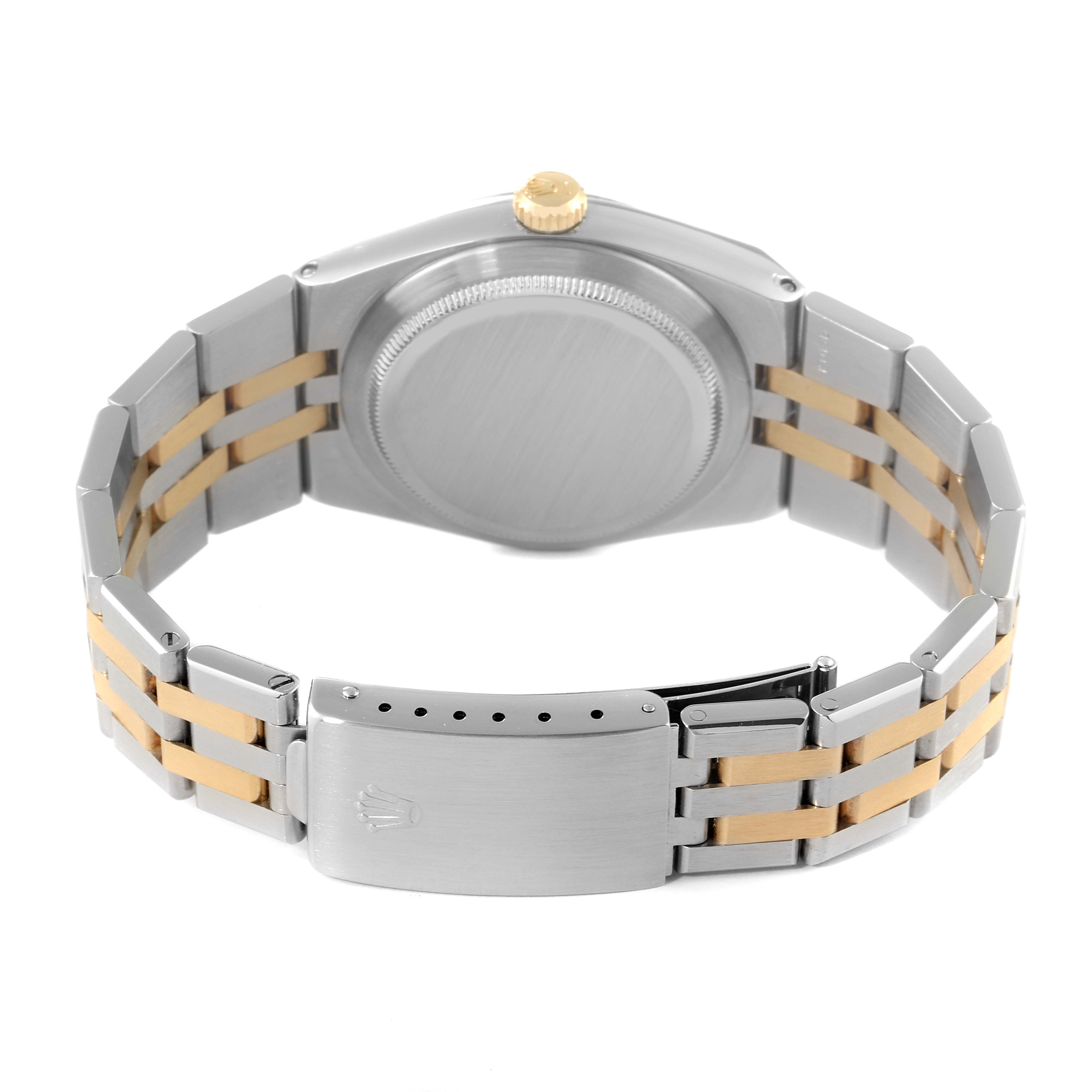 This image shows the back side and clasp of the Rolex Oysterquartz 17013 Men's Steel and Gold (two tone) White Dial 17013 Men's Steel and Gold (two tone) White Dial watch, highlighting its stainless steel and gold bracelet.