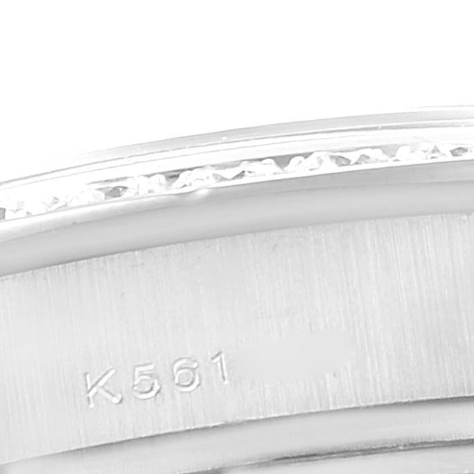 This close-up image shows the Rolex Pearlmaster 80299 Women's White Gold Mother of Pearl Dial 80299 Women's White Gold Mother of Pearl Dial watch's side, including its engravings and part of the bezel.