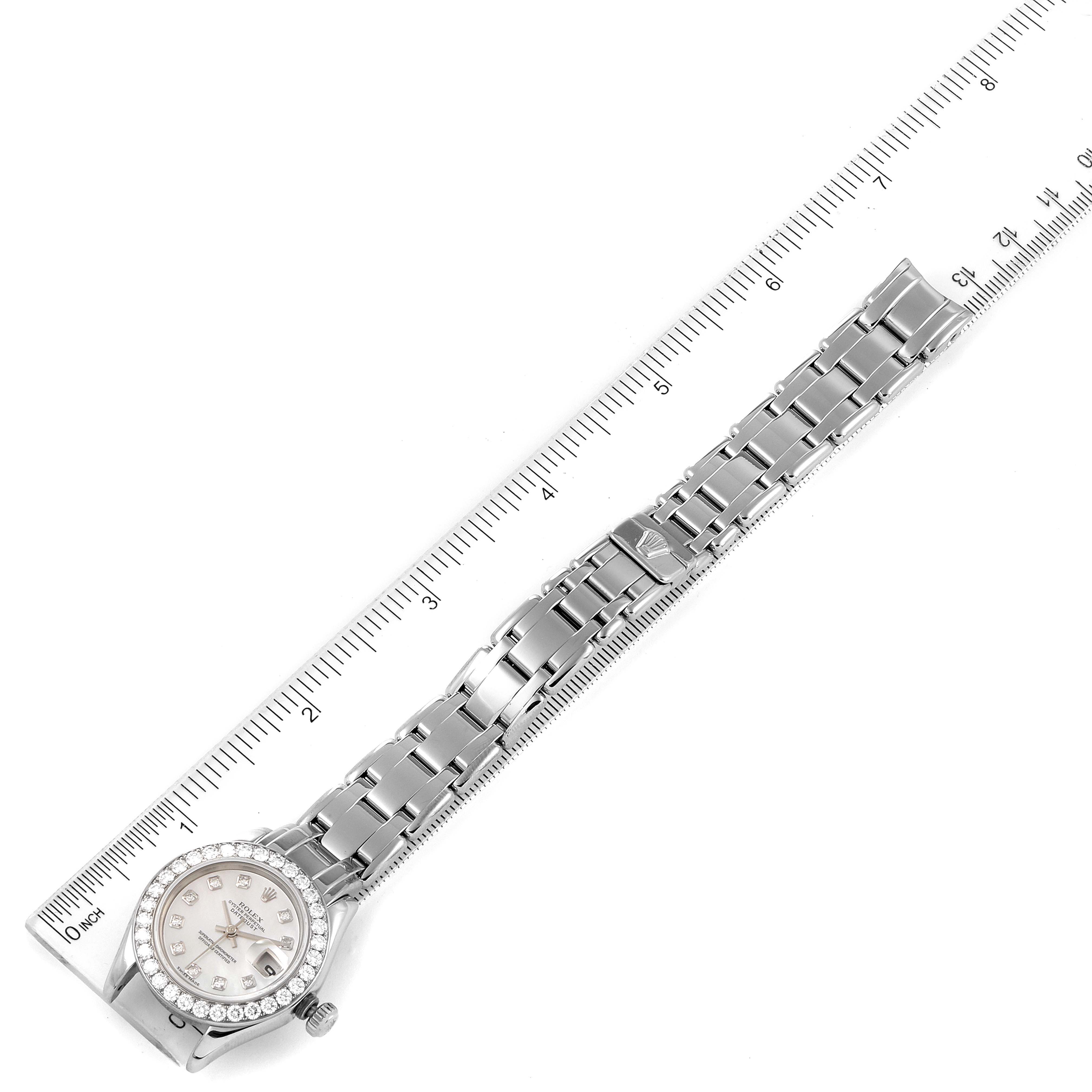 The image shows the Rolex Pearlmaster 80299 Women's White Gold Mother of Pearl Dial 80299 Women's White Gold Mother of Pearl Dial watch laid flat alongside a ruler, displaying the full length including the bracelet and face.