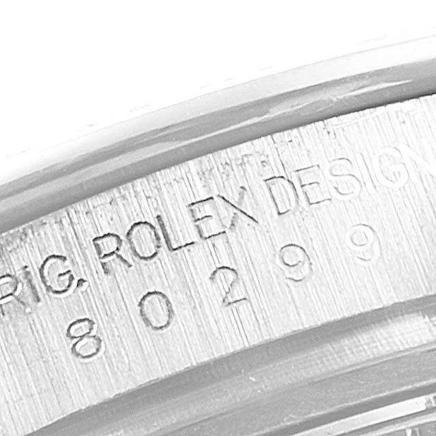 This image shows a close-up of the engraved case back of a Rolex Pearlmaster 80299 Women's White Gold Mother of Pearl Dial 80299 Women's White Gold Mother of Pearl Dial watch, highlighting the model number and "ROLEX DESIGN".