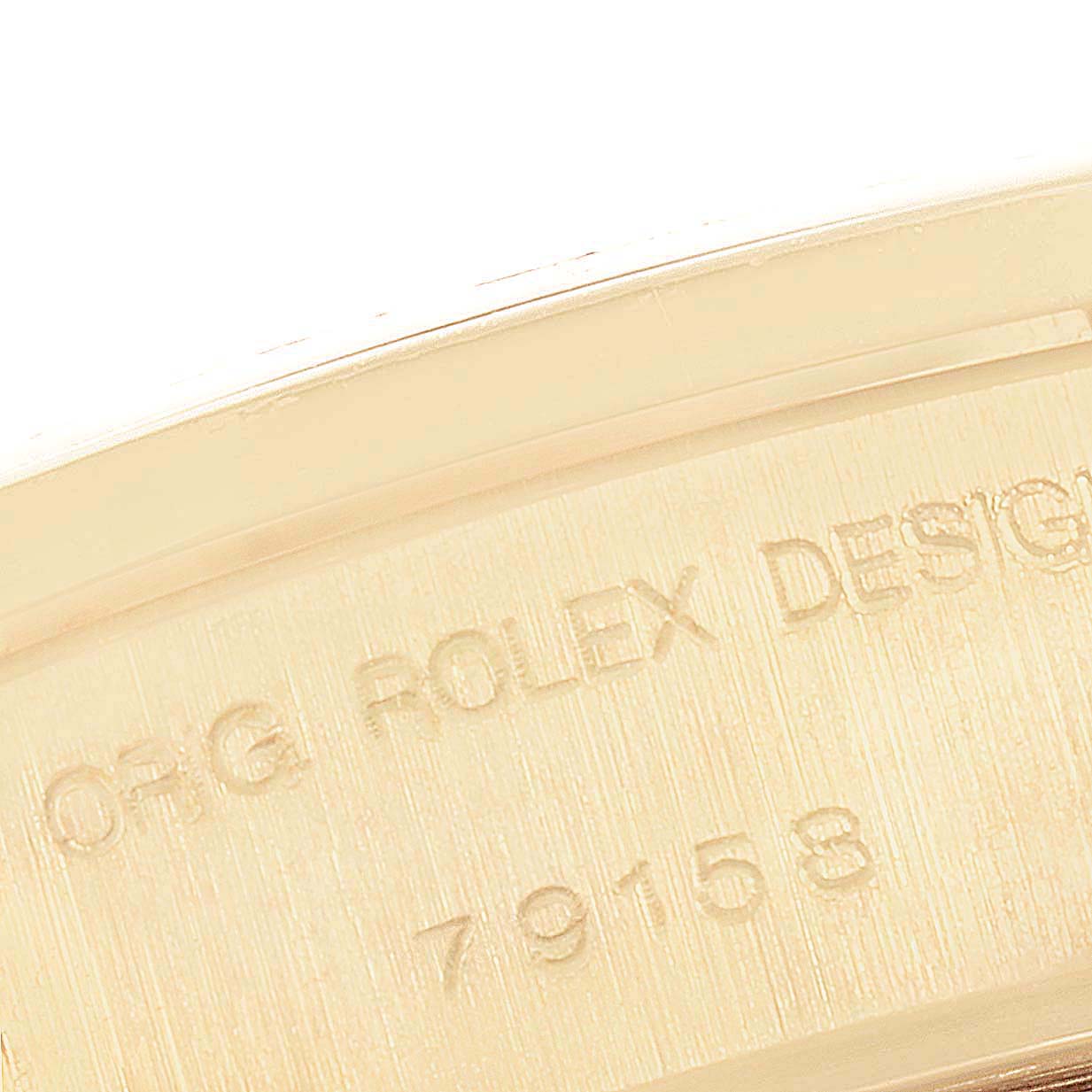 This close-up image shows the engraved model number and "Rolex Design" on the inside of the Rolex President 79158 Women
s Yellow Gold Champagne Dial 79158 Women
s Yellow Gold Champagne Dial watch.