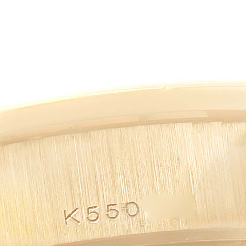 This image shows a close-up of the engraved serial number on the President model by Rolex.