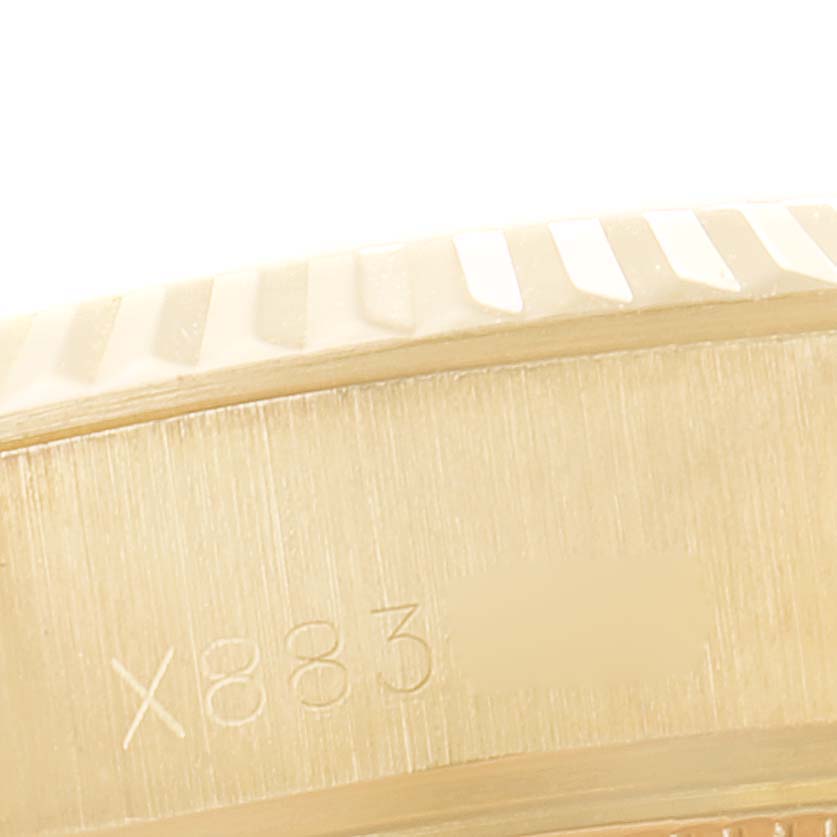 The image shows a close-up of the side engraving on the case of a Rolex President 69178 Women
s Yellow Gold Champagne Dial 69178 Women
s Yellow Gold Champagne Dial model watch.
