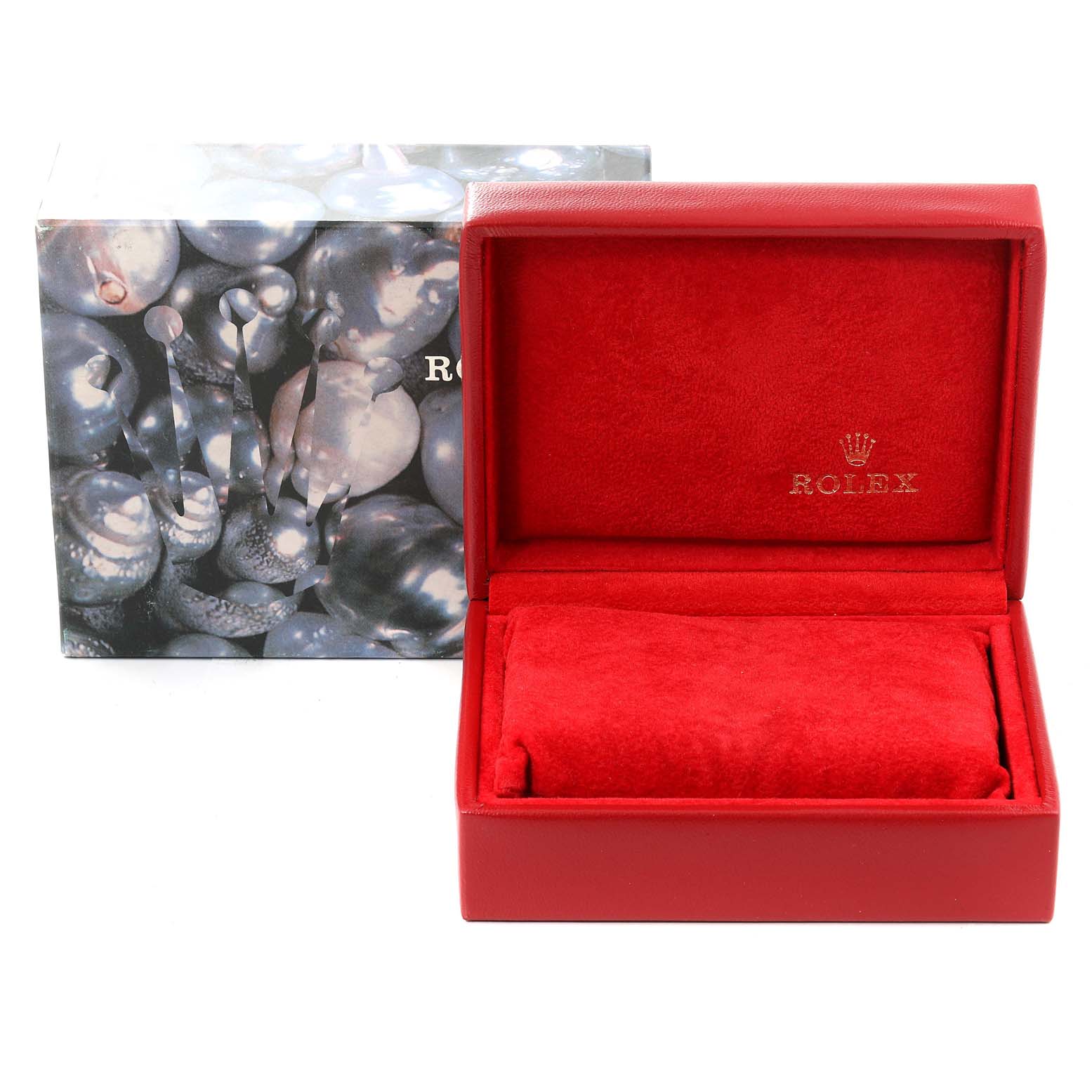 The image shows a red Rolex watch box, open to reveal its plush, velvety interior designed for the President model watch.