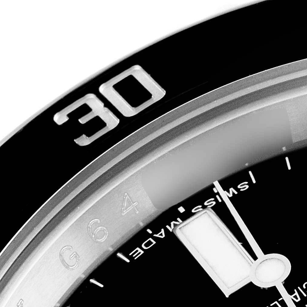 The close-up image shows the 30-minute marker on the black bezel and a portion of the dial of a Rolex Submariner 114060 Men
s Stainless Steel Black Dial 114060 Men
s Stainless Steel Black Dial watch.