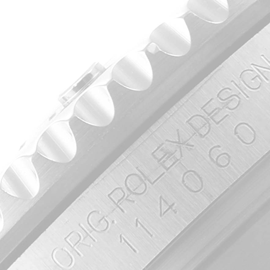 The image shows a close-up of the bezel and engraved side of a Rolex Submariner 114060 Men
s Stainless Steel Black Dial 114060 Men
s Stainless Steel Black Dial watch.