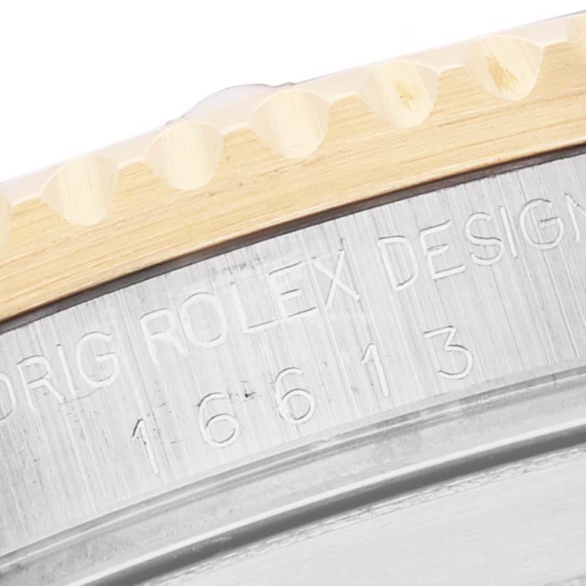 The image shows a close-up of the bezel and the model number engraving on the case of a Rolex Submariner 16613 Men's Steel and Gold (two tone) Blue Dial 16613 Men's Steel and Gold (two tone) Blue Dial watch.