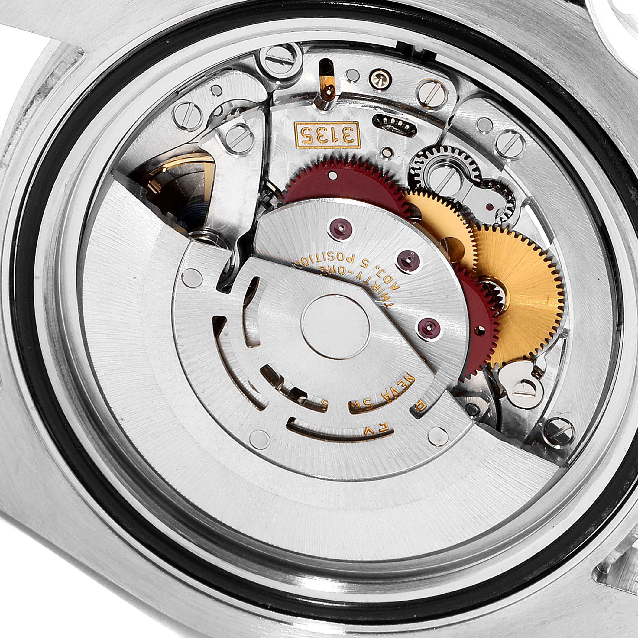 The image shows the movement of a Rolex Submariner 116610LN Men's Stainless Steel Black Dial 116610LN Men's Stainless Steel Black Dial watch, revealing gears and intricate components from a close-up angle.