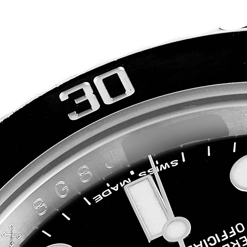 This is a close-up of the bezel and part of the dial of a Rolex Submariner 116610LN Men's Stainless Steel Black Dial 116610LN Men's Stainless Steel Black Dial watch, showing the 30-minute marker and some dial details.