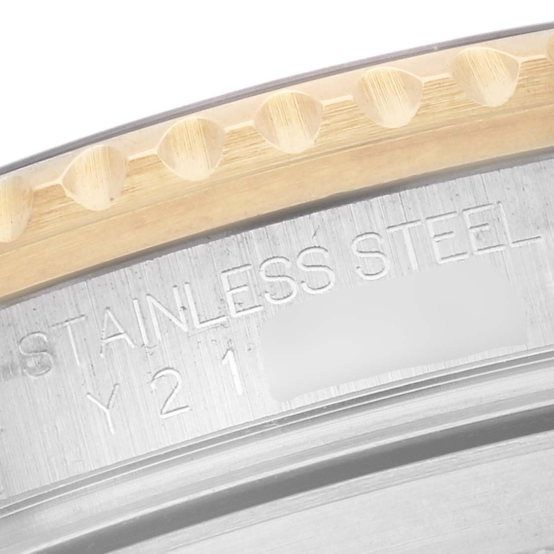 This close-up image shows a section of the case and bezel of a Rolex Submariner 16613 Men
s Steel and Gold (two tone) Black Dial 16613 Men
s Steel and Gold (two tone) Black Dial watch, highlighting the "Stainless Steel" inscription.