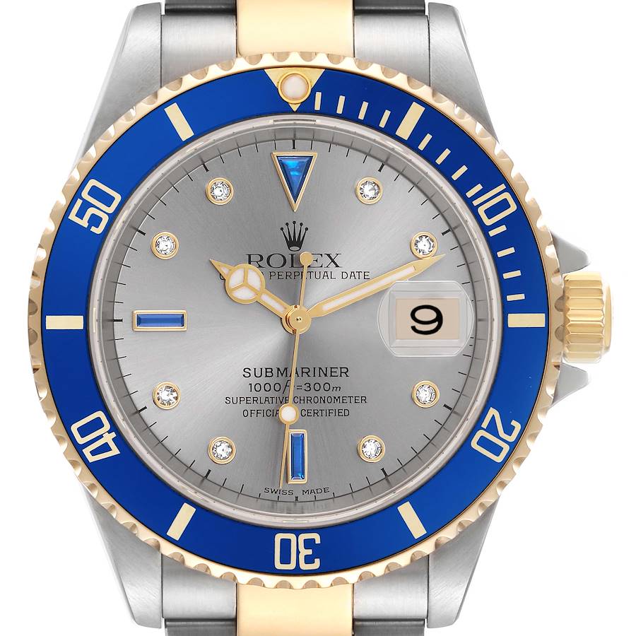 The Rolex Submariner watch is shown from the front, highlighting the blue bezel, grey dial, date window, and two-tone bracelet.