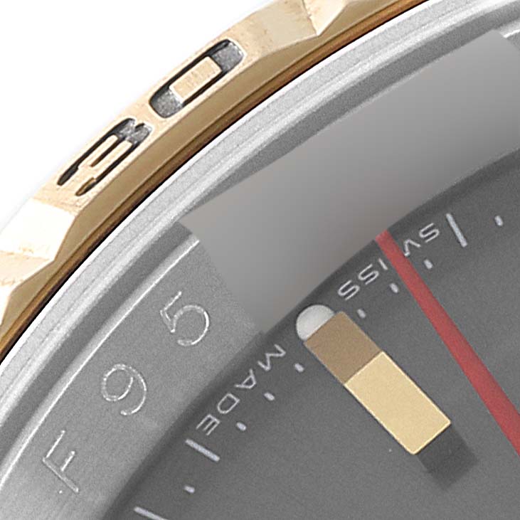 The image shows a close-up of the bezel, part of the dial, and the minute hand of a Rolex Turn-o-Graph 116263 Men's Steel and Gold (two tone) Grey Dial 116263 Men's Steel and Gold (two tone) Grey Dial watch.