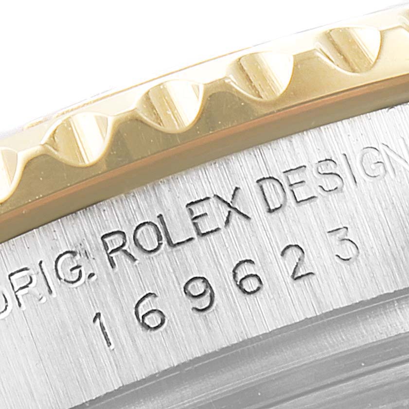 The image shows a close-up of the Rolex Yacht-Master 169623 Women's Steel and Gold (two tone) White Dial 169623 Women's Steel and Gold (two tone) White Dial watch case and bezel, highlighting the model number and brand engraving.